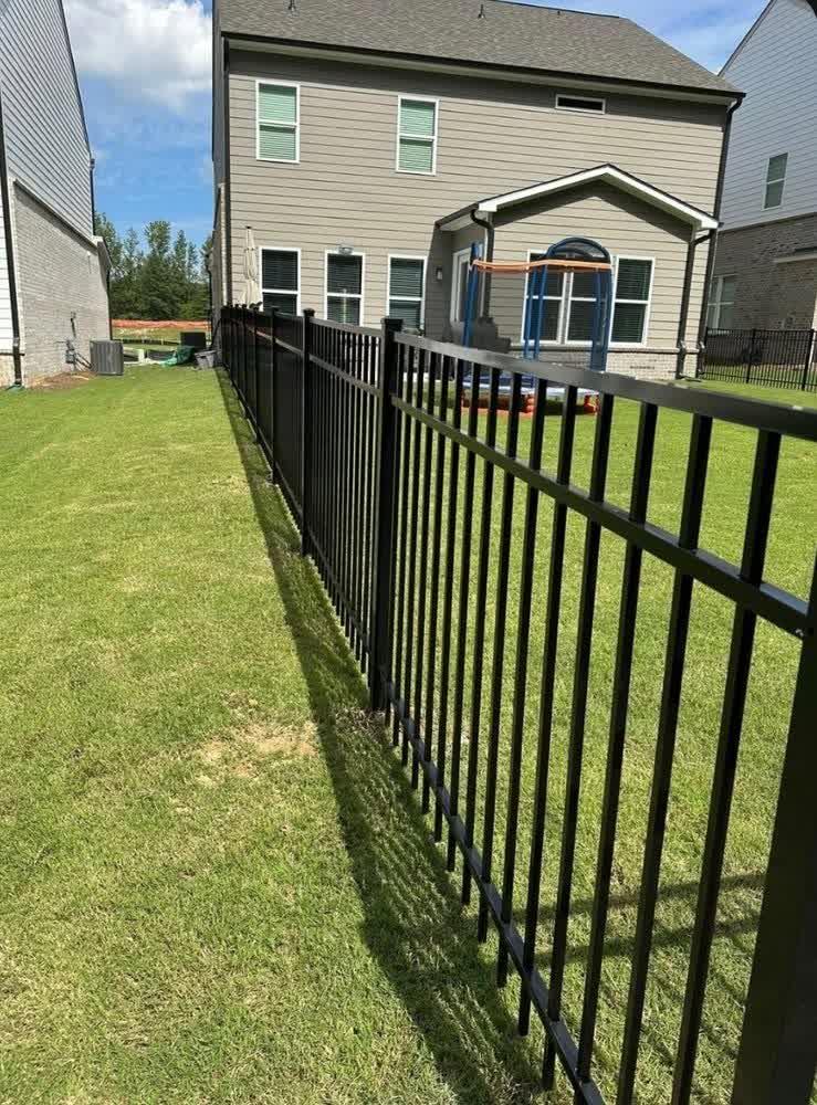 Curved aluminum fence following property line