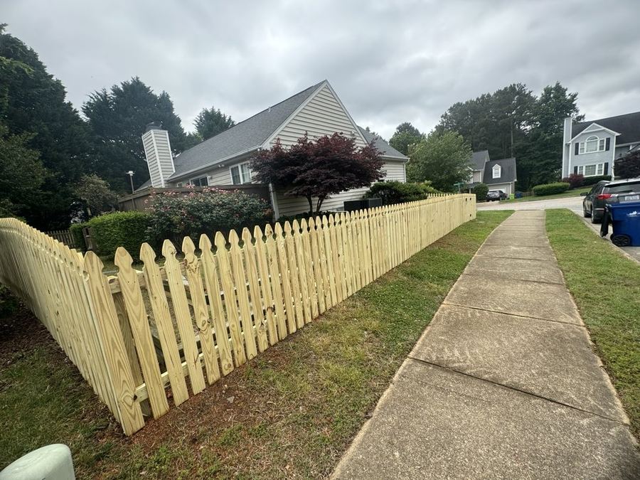 Classic picket fence along driveway