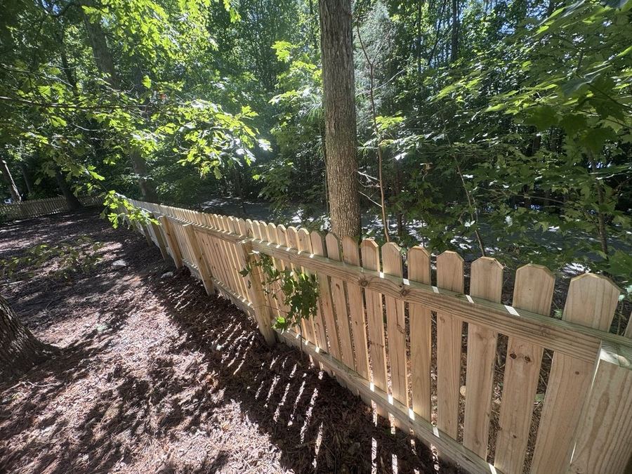 Classic white picket fence on front yard