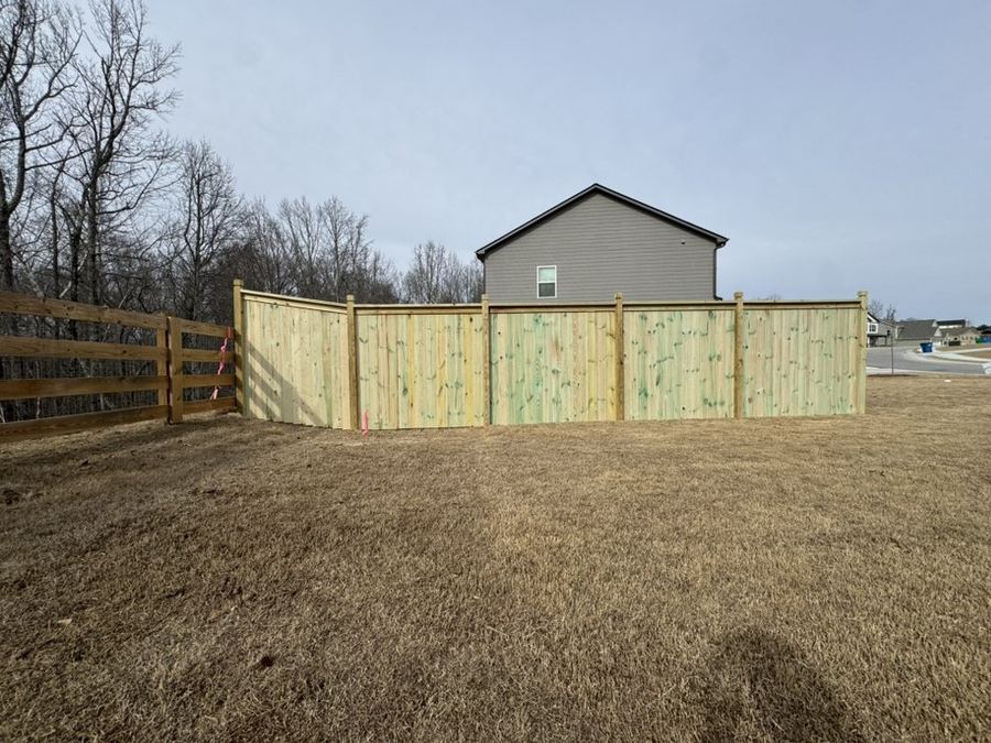 Wood cap and trim fence on a residential property in the Triangle NC area