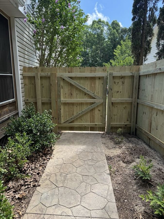 Dog-ear wood fence with walk gate