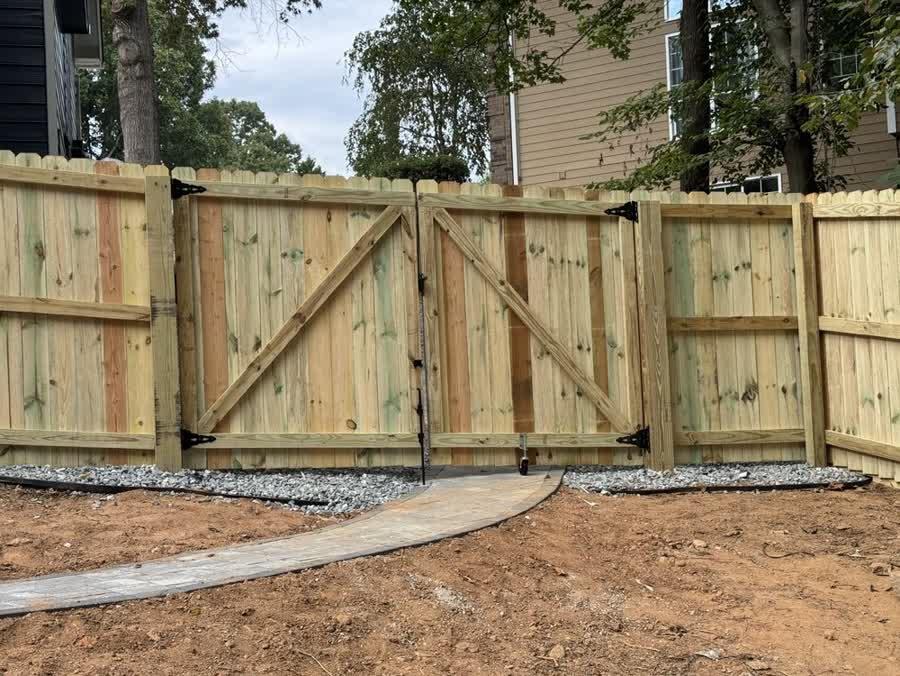Interior view of a double wood gate showing quality framing and diagonal bracing in Triangle NC