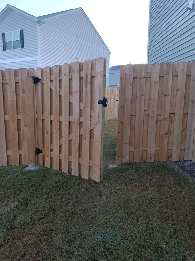 Shadowbox wood fence with matching gate